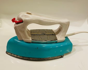 Vintage turquoise blue and white mid century child’s iron