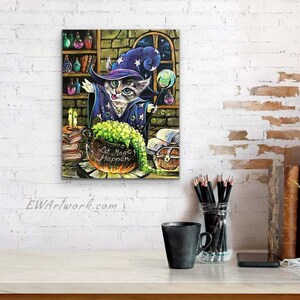 May include: A cartoon cat wearing a purple and blue wizard hat and robe stirs a green potion in a cauldron. The cauldron is labeled "Let Magic Happen". The cat is surrounded by books, candles, and other magical items.