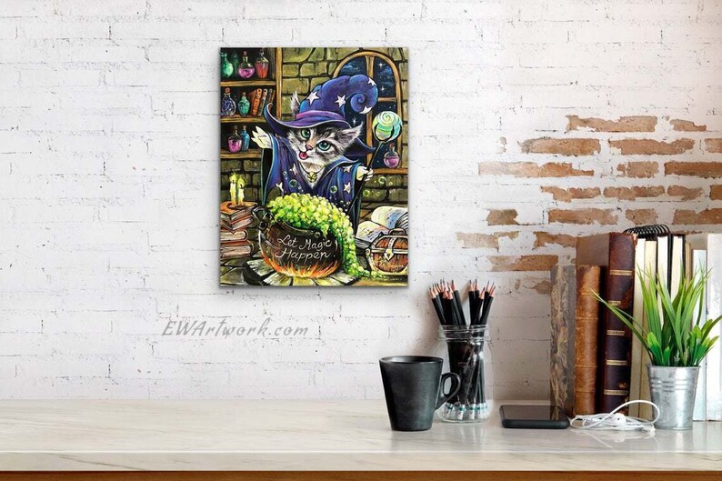 May include: A cartoon cat wearing a purple and blue wizard hat and robe stirs a green potion in a cauldron. The cauldron is labeled "Let Magic Happen". The cat is surrounded by books, candles, and other magical items.