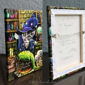 May include: A painting of a cat dressed as a wizard with a blue hat and robe, holding a wand. The cat is standing in front of a cauldron with green liquid and the words "Let Magic Happen". The painting is set in a magical room with bookshelves, candles, and a window with stars.