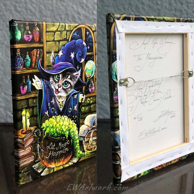 May include: A painting of a cat dressed as a wizard with a blue hat and robe, holding a wand. The cat is standing in front of a cauldron with green liquid and the words "Let Magic Happen". The painting is set in a magical room with bookshelves, candles, and a window with stars.