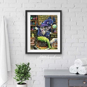 May include: A framed illustration of a cat wearing a wizard hat and holding a wand. The cat is standing in front of a cauldron with green liquid and the text "Let Magic Happen".