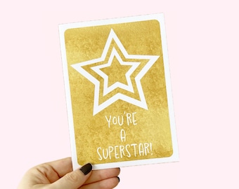 May include: A gold card with a white star and the text "You're a Superstar!"