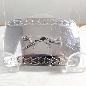 Shiny Belt Buckle Featuring a Jaguar