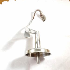 May include: A polished, stainless steel mixer attachment, probably for a stand mixer. It features a curved hook at the top, a flat blade, and a circular base with a central post. The item is set against a white background.