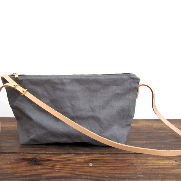 Sale now 25% off. Grey washed canvas crossbody bag. Nude leather adjustable skinny strap with brass buckle. A perfect every day bag.