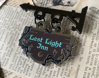 Last Light Inn shop sign enamel pin