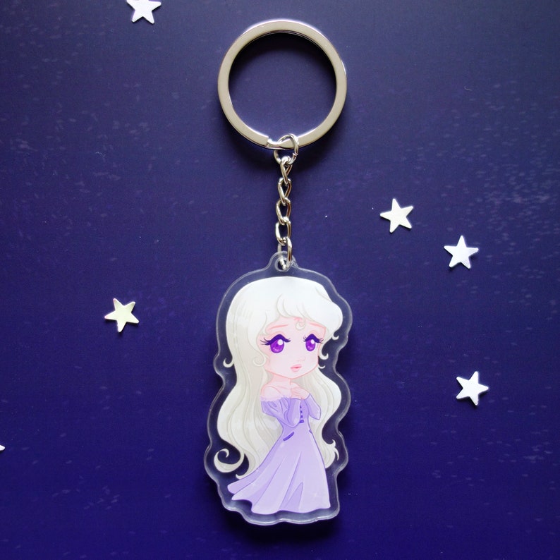 Clear acrylic keychain 6cm with silver ring of Amalthea (The Last Unicorn).