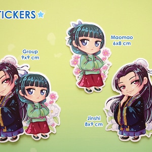 Stickers with white edge of Jinshi and Maomao from manga series The Apothecary Diaries. In the left, the couple are together in the sticker; in the center,  there's just Maomao with pink flowers and in the right, there's just Jinshi with white flower