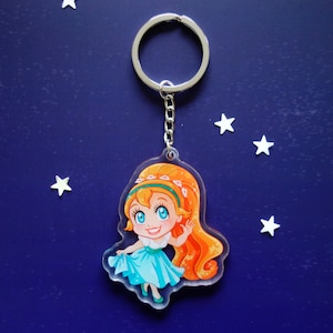 Clear acrylic keychain 6cm with silver ring of Thumbelina holding her skirt.