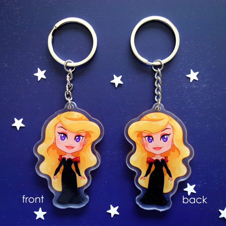 Clear acrylic keychains 6cm with silver ring of Odile (Swan Princess) shown front and back side, with the same print, with black dress.