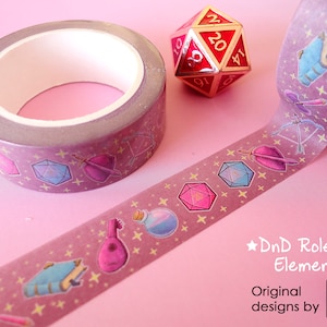 Washi tapes with a pattern of Dungeons and Dragons elements on a purple background: dices, bow, axe, shield, book, potion, lute, etc