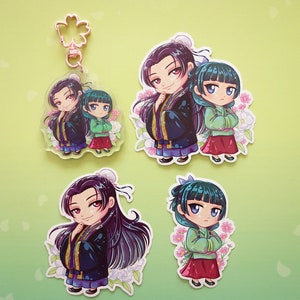 Stickers and keychain with pink flower clasp of Jinshi and Maomao from manga series The Apothecary Diaries.