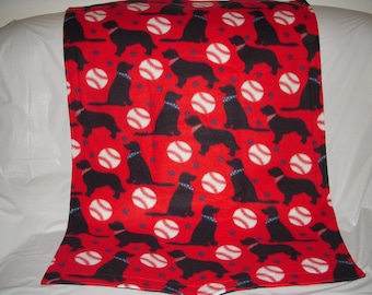 Doggy Blanket - cute black dogs and baseballs on red print fleece with the same print on the reverse side