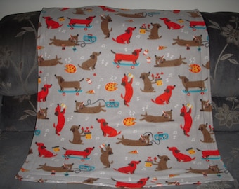 Doggy Blanket - cute little skateboarding dogs on light gray fleece with the same print on the reverse side