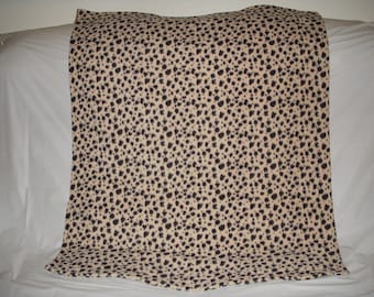 Pet Blanket - small black spots on tan fleece with the same print on the reverse side.