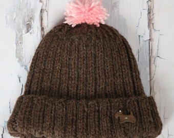 childs brown knit hat with doggy button