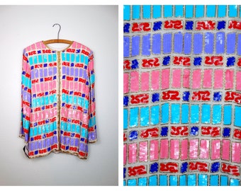 Cárdigan vintage con lentejuelas: chaqueta con bloques de colores pastel y cuentas doradas