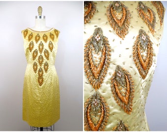 Jaren 60 gouden cocktailjurk met kralen, couture uit het midden van de eeuw