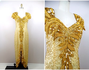 May include: A gold sequined evening gown with a sweetheart neckline and short sleeves. The gown is embellished with gold beads and sequins, creating a luxurious and glamorous look.