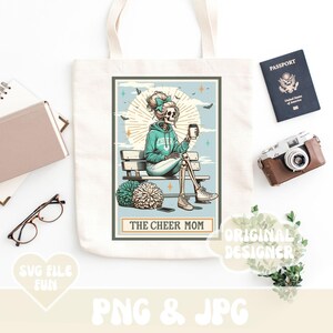 May include: A tote bag with a graphic of a skeleton wearing a cheerleading uniform and holding a cup of coffee. The graphic is on a white background and the text "The Cheer Mom" is below the graphic.