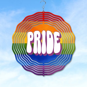 May include: A rainbow-colored metal wind spinner with the word "PRIDE" in white letters. The spinner has a hook at the top for hanging.