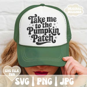 May include: A green and white trucker hat with the text "Take me to the Pumpkin Patch" in a retro font. The hat has a curved brim and a mesh back. The design includes star accents.