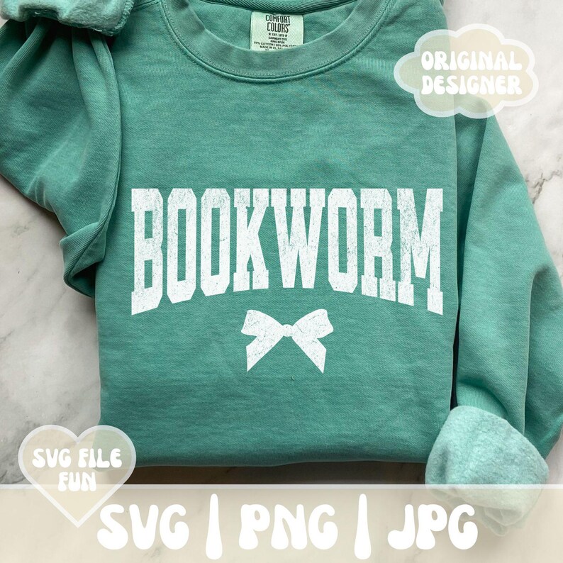 May include: A teal sweatshirt with the text "BOOKWORM" in white with a white bow underneath. The sweatshirt has a distressed look.