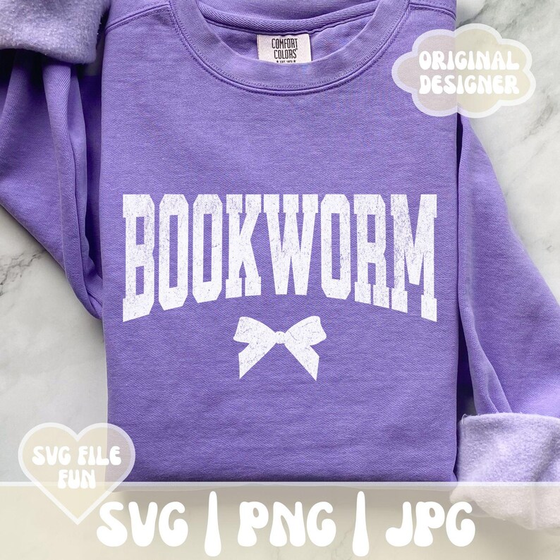 May include: Purple sweatshirt with the text "BOOKWORM" in white with a white bow underneath. The sweatshirt has a distressed look.
