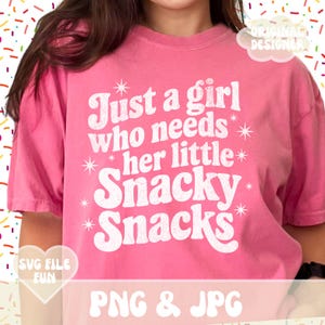 May include: A pink t-shirt with the text "Just a girl who needs her little Snacky Snacks" in white. The shirt also has the text "SVG FILE FUN" and "PNG & JPG". The words "ORIGINAL DESIGNER" are also visible.