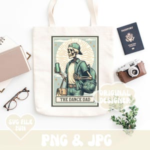 May include: A tote bag featuring a graphic of a skeleton wearing a green shirt and holding a can of beer. The text "The Dance Dad" is below the skeleton.