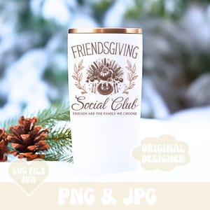 May include: A white Friendsgiving Social Club tumbler with a gold rim. The tumbler features a detailed illustration of a Thanksgiving meal with the text "Friends are the family we choose".