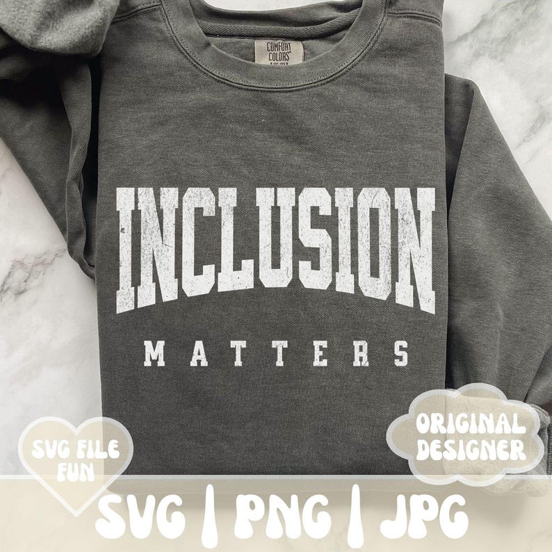 May include: A gray sweatshirt with the text "INCLUSION MATTERS" in white lettering. The sweatshirt is a popular style for casual wear.