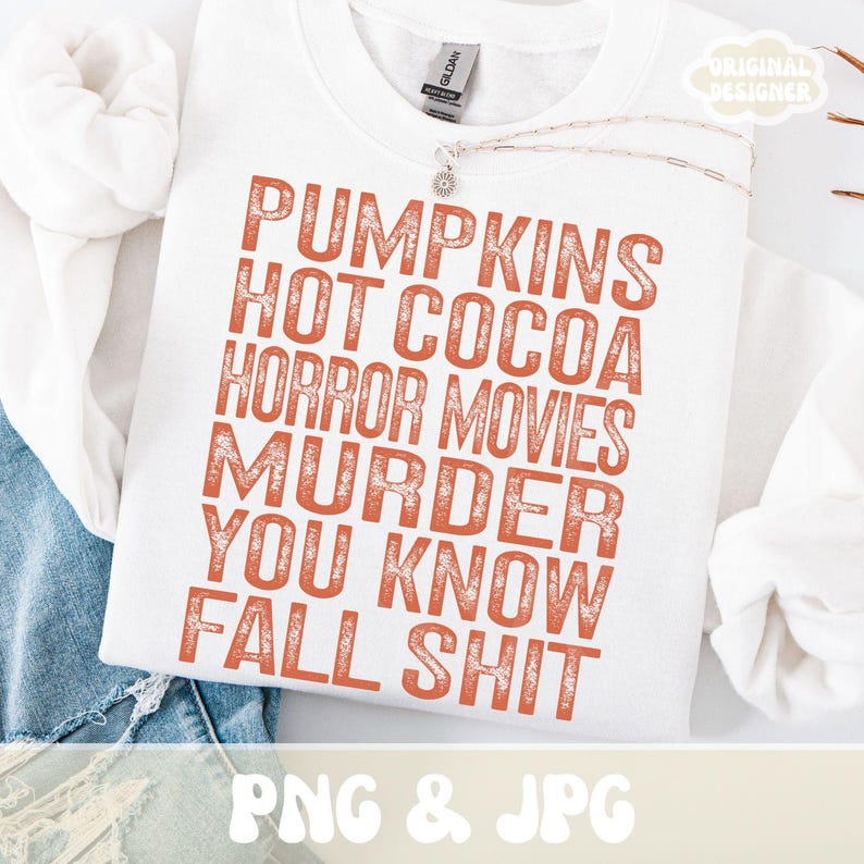 Puede incluir: Sudadera blanca con texto naranja: "PUMPKINS HOT COCOA HORROR MOVIES MURDER YOU KNOW FALL SHIT." La sudadera tiene cuello redondo y mangas largas. Las palabras "PNG & JPG" est&aacute;n en la parte inferior.