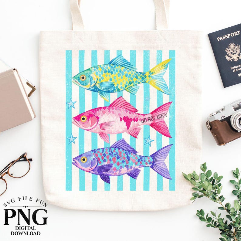 May include: A cream-colored tote bag featuring three colorful fish illustrations against a blue striped background. The fish are in shades of yellow, pink, and purple. The text "SVG FILE FUN PNG DIGITAL DOWNLOAD" is at the bottom.