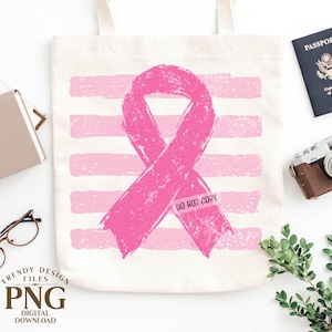 May include: A cream-colored canvas tote bag featuring a large, distressed pink awareness ribbon centered over a background of horizontal pink brushstroke stripes. The ribbon includes the faint, semi-transparent text DO NOT COPY.