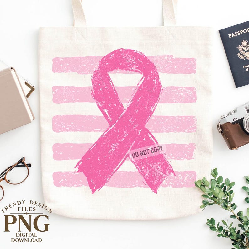 May include: A cream-colored canvas tote bag featuring a large, distressed pink awareness ribbon centered over a background of horizontal pink brushstroke stripes. The ribbon includes the faint, semi-transparent text DO NOT COPY.