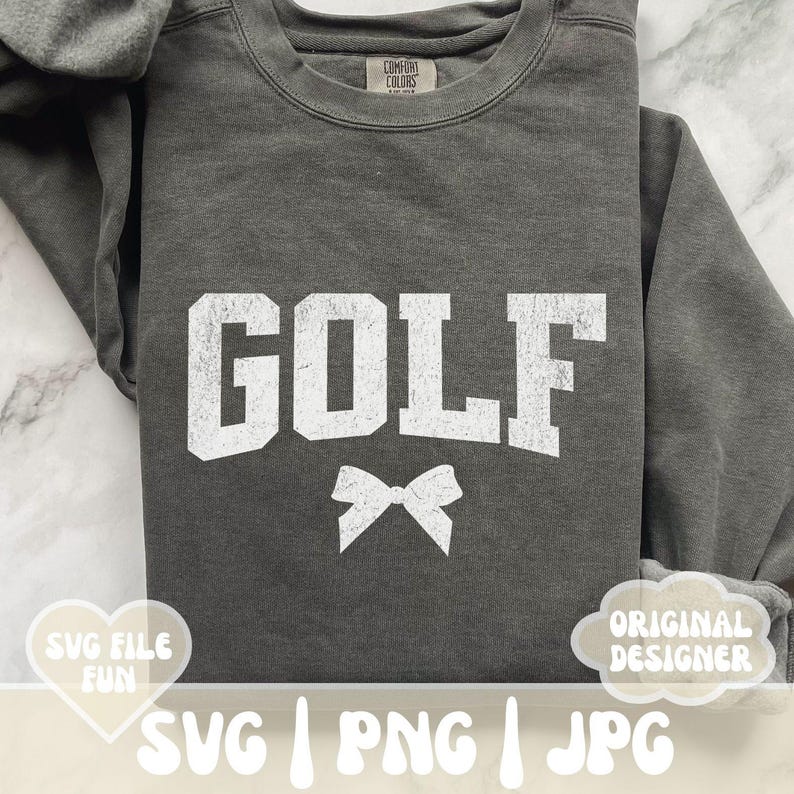 May include: Gray sweatshirt with the word "GOLF" in white text and a white bow. The sweatshirt is a comfortable, casual style.
