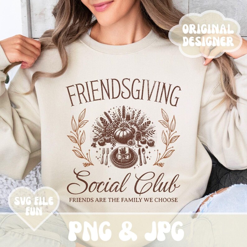 May include: Beige Friendsgiving sweatshirt with a brown graphic. The graphic includes a pumpkin, plate setting, and the words "FRIENDSGIVING Social Club". The text "FRIENDS ARE THE FAMILY WE CHOOSE" is also present. The image also includes the text "SVG FILE FUN" and "PNG & JPG".