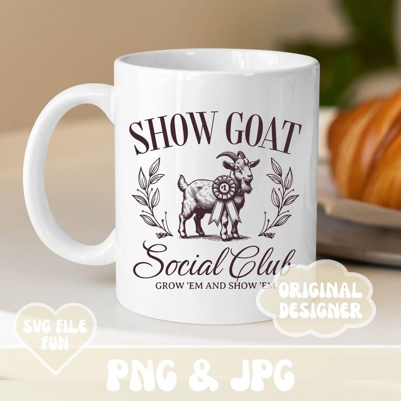May include: White ceramic coffee mug with a black and white illustration of a goat with a ribbon. The text "SHOW GOAT Social Club GROW 'EM AND SHOW 'EM" is printed on the mug.