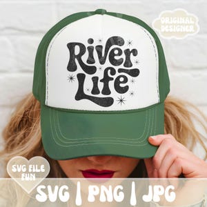 May include: A green and white trucker hat with the words "River Life" in black script. The hat has a curved brim and a mesh back. The text "SVG | PNG | JPG" is at the bottom of the image.
