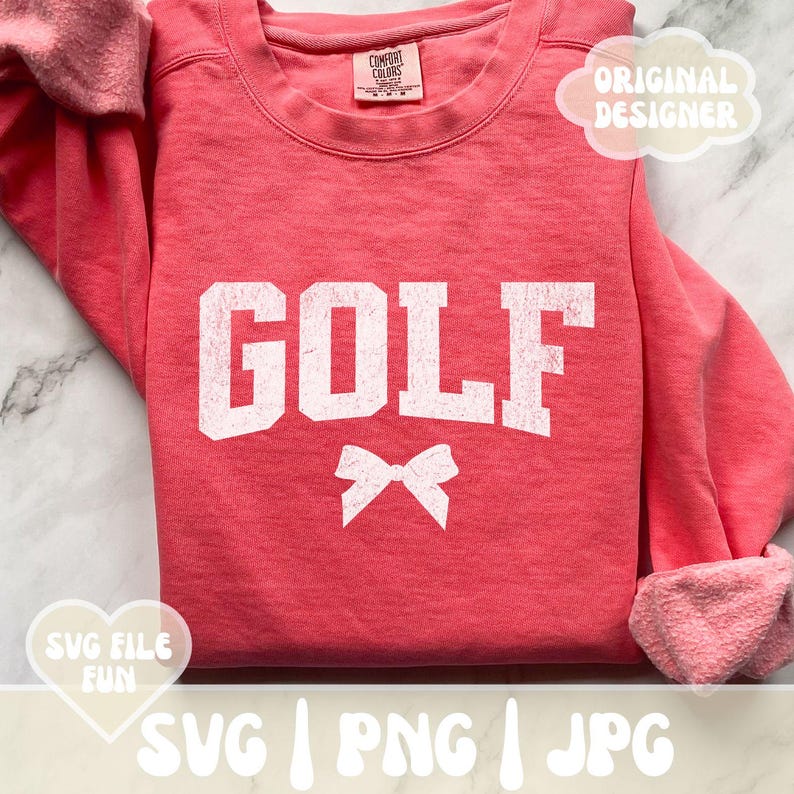 May include: A pink sweatshirt with the word "GOLF" in white with a white bow underneath. The sweatshirt has a distressed look.