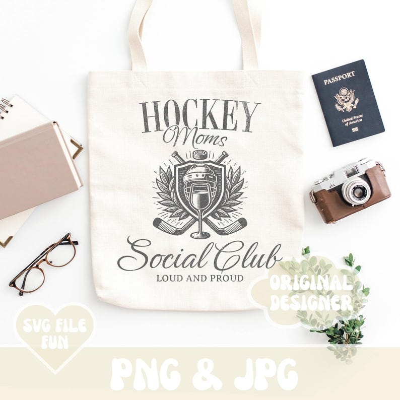 May include: A white tote bag with a black and white graphic design that says "Hockey Moms Social Club Loud and Proud". The graphic features a hockey helmet, sticks, and a wreath.