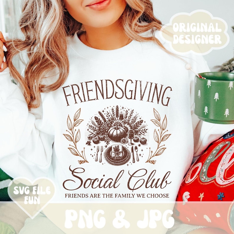 May include: White Friendsgiving Social Club sweatshirt with a brown graphic design. The design includes the text "FRIENDSGIVING Social Club" with a Thanksgiving-themed illustration. The phrase "FRIENDS ARE THE FAMILY WE CHOOSE" is also included.