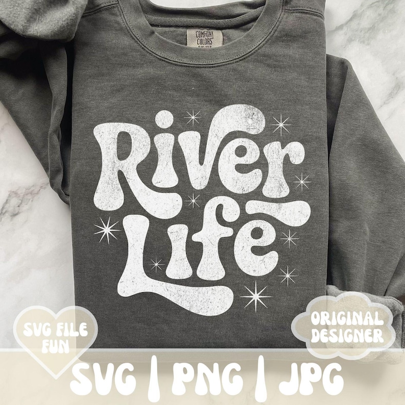 May include: Dark gray sweatshirt with the words "River Life" in a white, retro font. The design includes starburst accents. The sweatshirt also has the text "SVG FILE FUN" and "ORIGINAL DESIGNER".