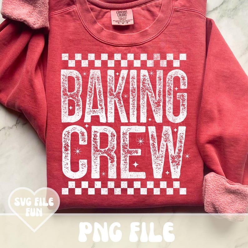 May include: A red sweatshirt with the words "BAKING CREW" in large white letters. The text is framed by a checkered pattern. The sleeves are cuffed, and the shirt has a crew neck. The words "SVG FILE FUN" and "PNG FILE" are also visible.