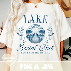 May include: A white t-shirt with a blue graphic design that says "LAKE Social Club LAKE LIFE IS THE BEST LIFE".