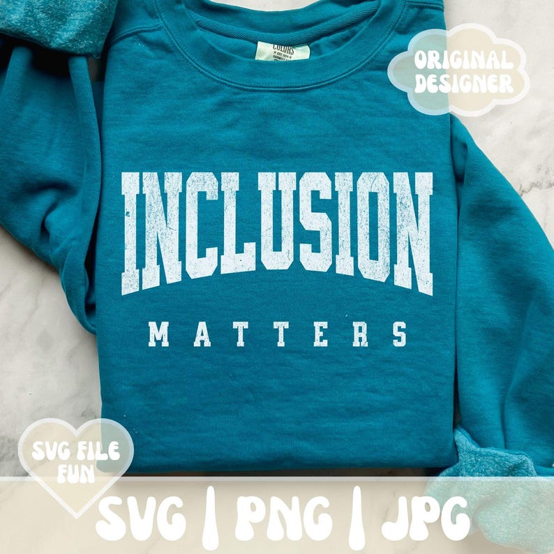 May include: Teal blue sweatshirt with the text "INCLUSION MATTERS" in white distressed lettering.