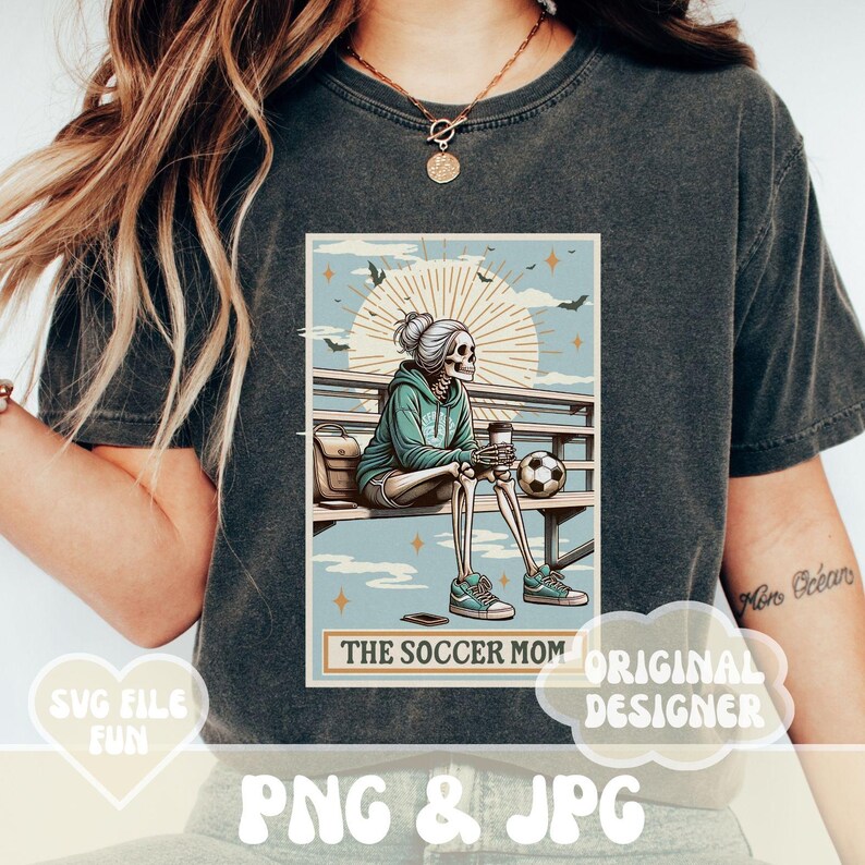 May include: A vintage-style illustration of a skeleton wearing a blue hoodie and sitting on a bench with a coffee cup and soccer ball. The text "The Soccer Mom" is below the image.