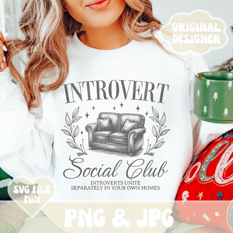 May include: White sweatshirt with a black graphic design that says "Introvert Social Club" with a couch and stars. The text below the graphic says "Introverts Unite Separately in Your Own Homes".